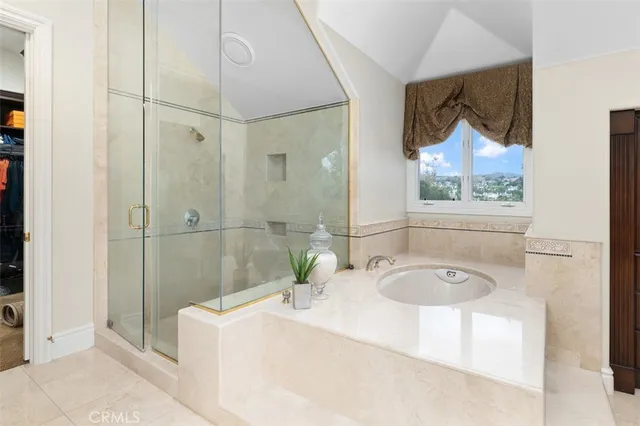 a large kitchen with a sink and a large counter space