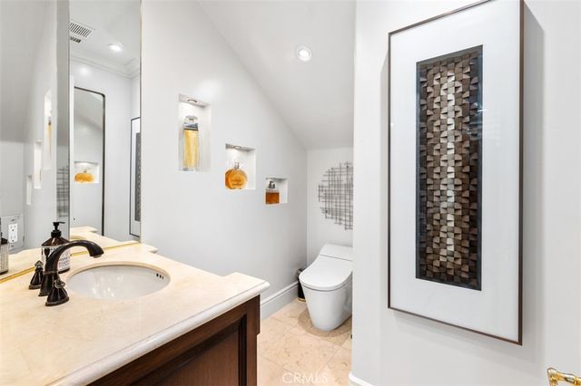 a bedroom with a bed and a chair