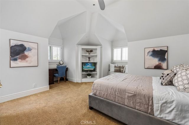 an aerial view of residential houses with outdoor space and street view