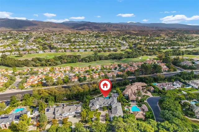 an aerial view of residential houses with outdoor space and street view