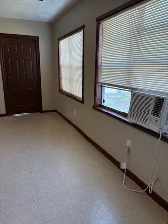 an empty room with windows