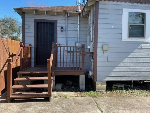a front view of a house with stairs