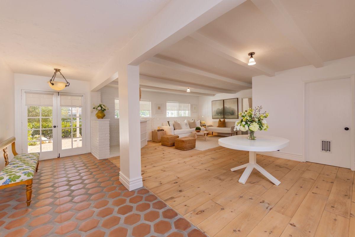 930 Fairview Road Ojai, CA 93023 - Photo 11 of 30 a view of a livingroom with dining area a chandelier fan and windows