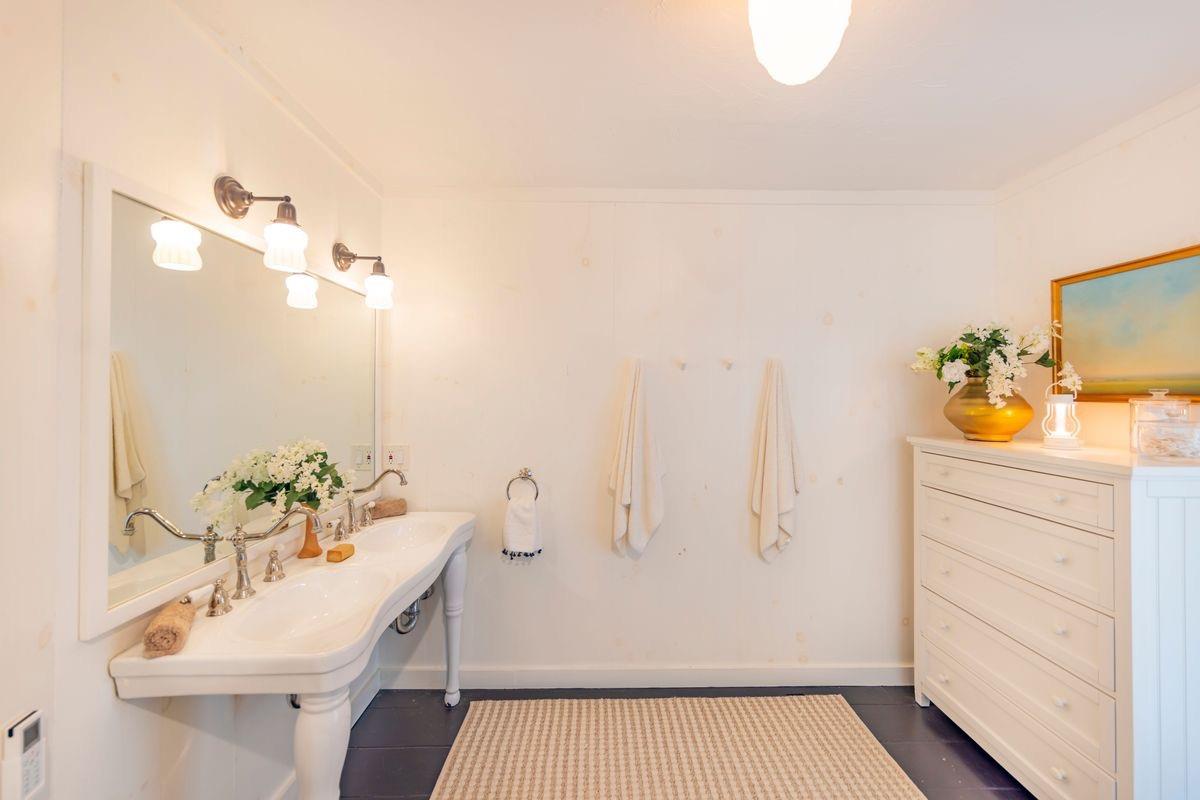 930 Fairview Road Ojai, CA 93023 - Photo 16 of 30 a bathroom with a sink a mirror and a shower