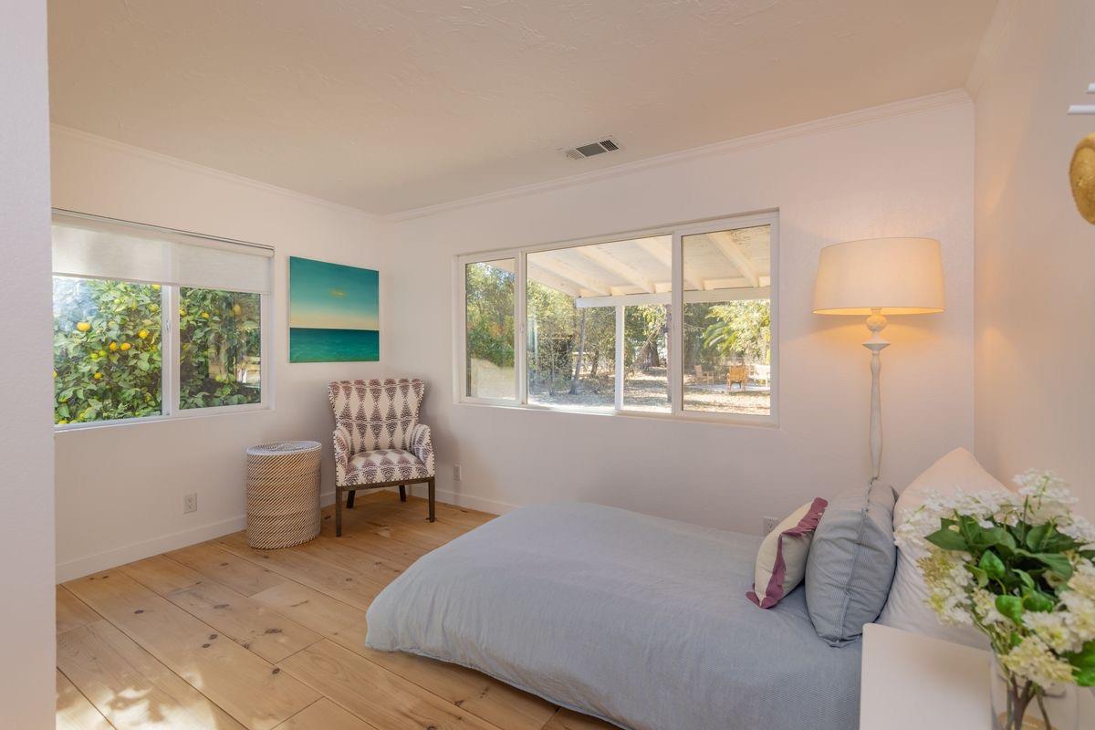 930 Fairview Road Ojai, CA 93023 - Photo 19 of 30 a bedroom with a bed and window