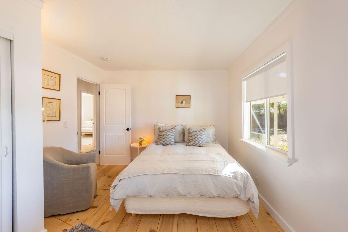 930 Fairview Road Ojai, CA 93023 - Photo 21 of 30 a bedroom with a bed and wooden floor