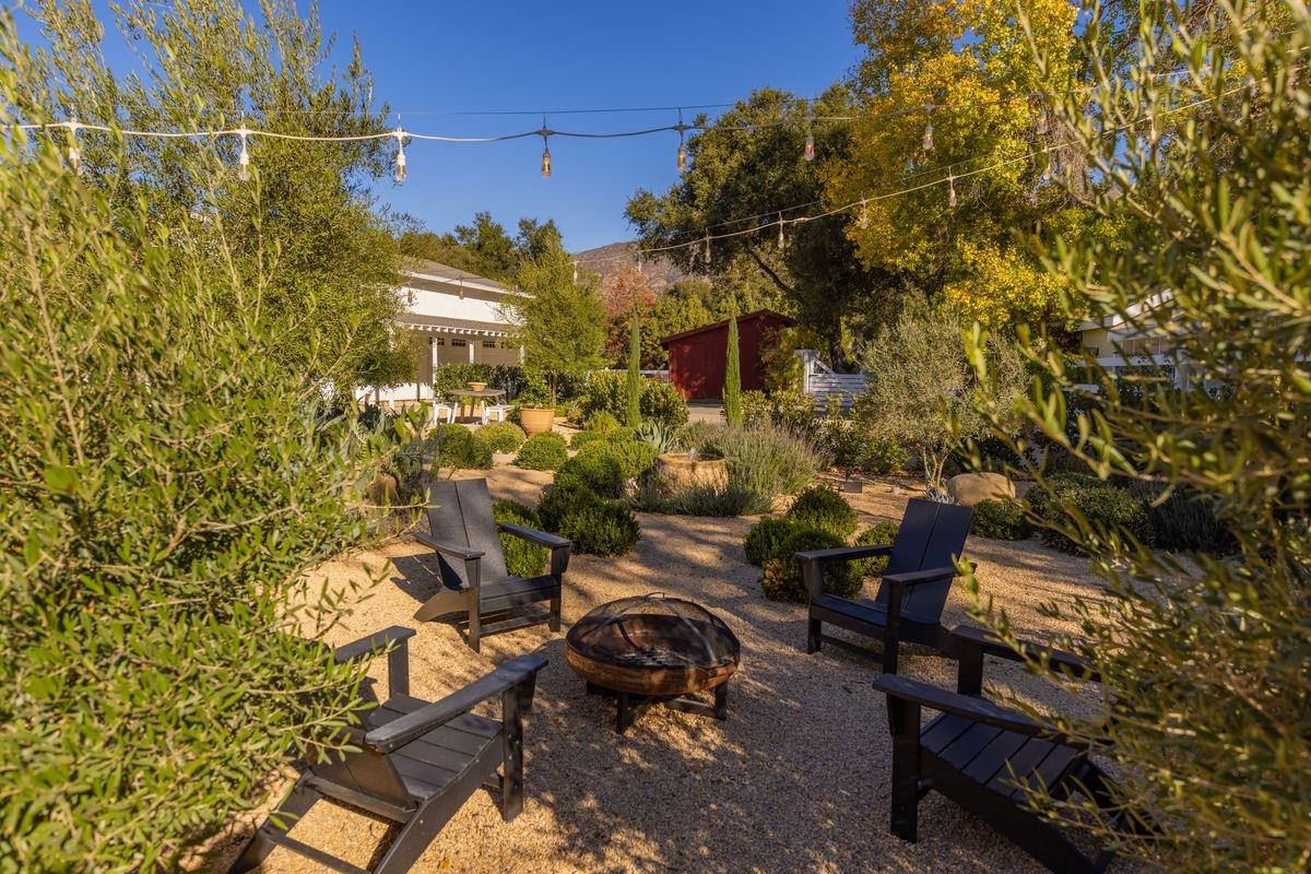 930 Fairview Road Ojai, CA 93023 - Photo 27 of 30 a view of a chairs and table in a backyard