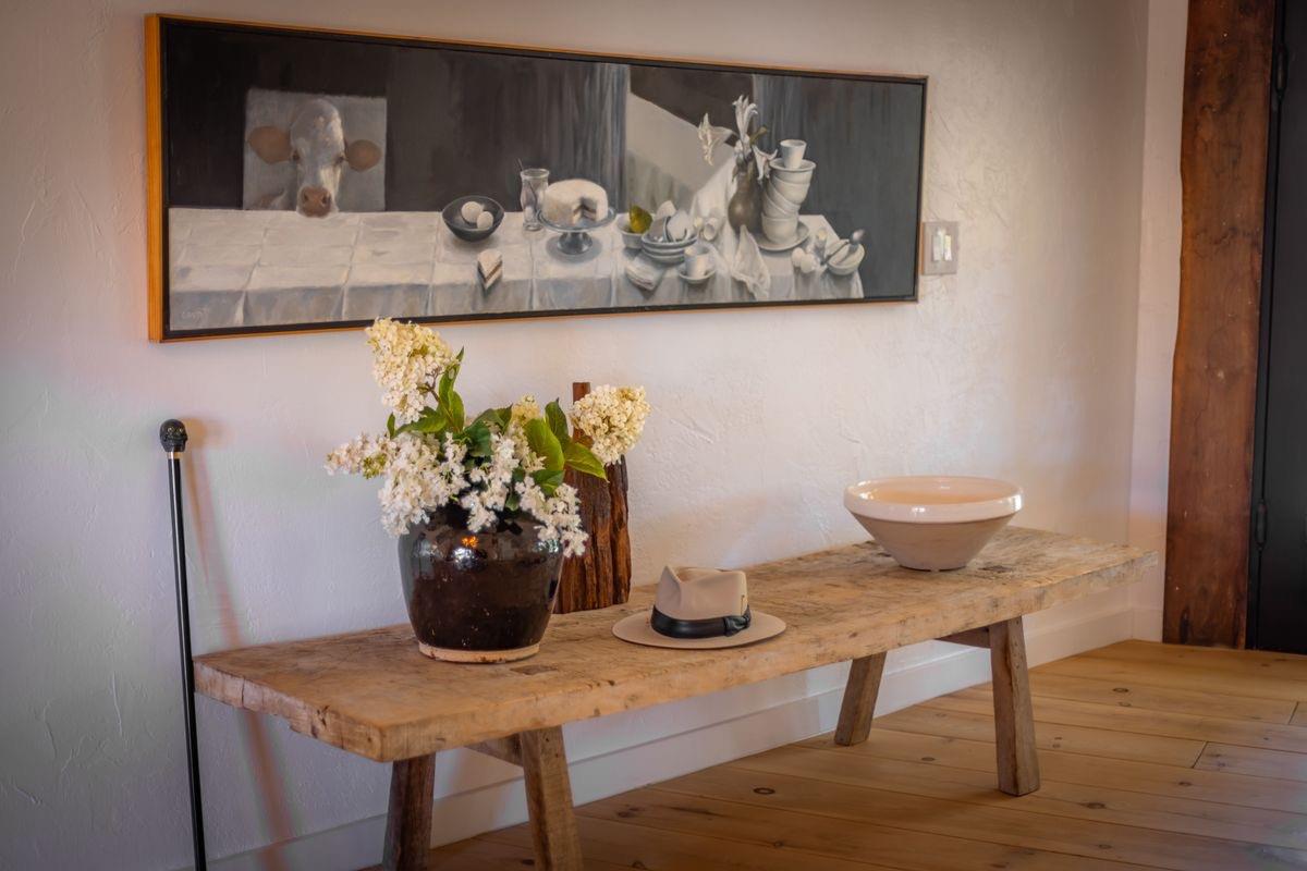 930 Fairview Road Ojai, CA 93023 - Photo 5 of 30 a table with a vase and flowers on it