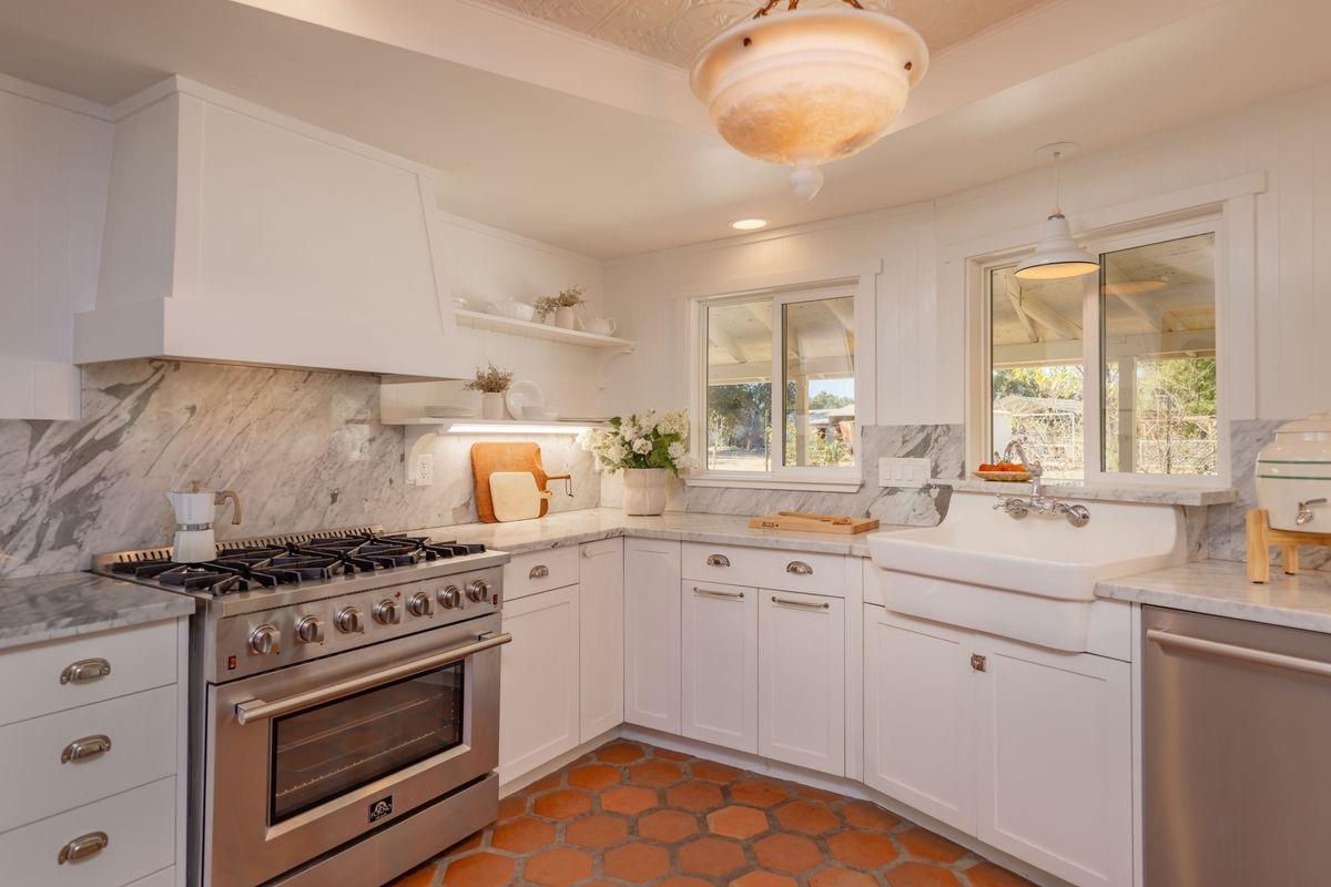 930 Fairview Road Ojai, CA 93023 - Photo 7 of 30 a kitchen with a sink stove and cabinets