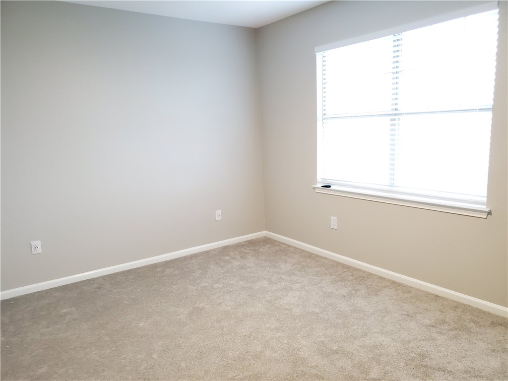 11203 Ranch Road 2222, Unit 302 Austin, TX 78732 - Photo 11 of 18 Master bedroom with large window for lots of natural light