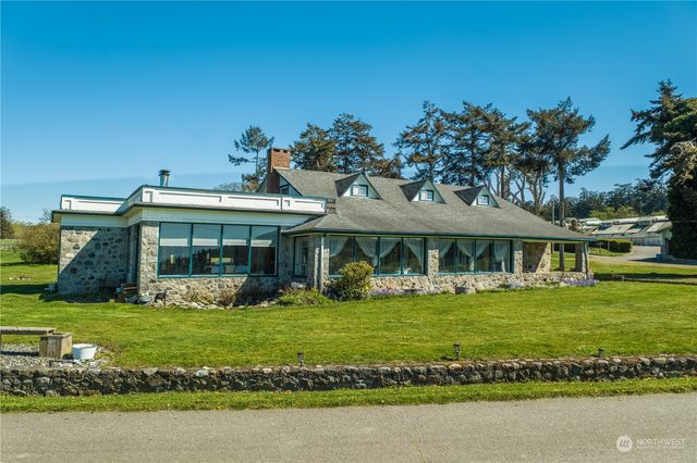an aerial view of a house with outdoor space