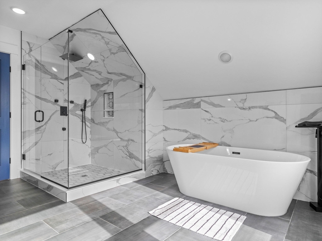 62 Governor Winthrop Road, Unit 2 Somerville, MA 02145 - Photo 18 of 32 a bathroom with a bathtub and shower