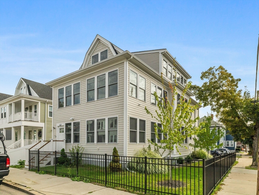 62 Governor Winthrop Road, Unit 2 Somerville, MA 02145 - Photo 27 of 32 a front view of a house with a yard
