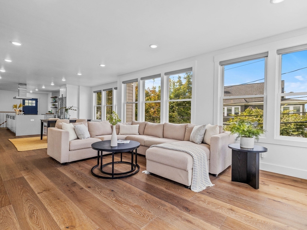 62 Governor Winthrop Road, Unit 2 Somerville, MA 02145 - Photo 3 of 32 a living room with furniture and a large window
