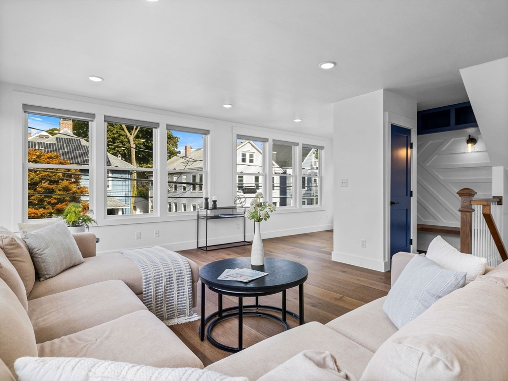 62 Governor Winthrop Road, Unit 2 Somerville, MA 02145 - Photo 4 of 32 a living room with furniture and a table