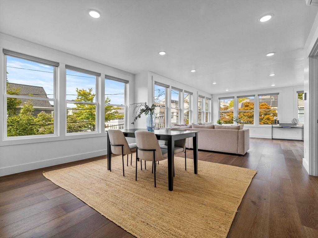 62 Governor Winthrop Road, Unit 2 Somerville, MA 02145 - Photo 5 of 32 a view of a dining room with furniture and wooden floor