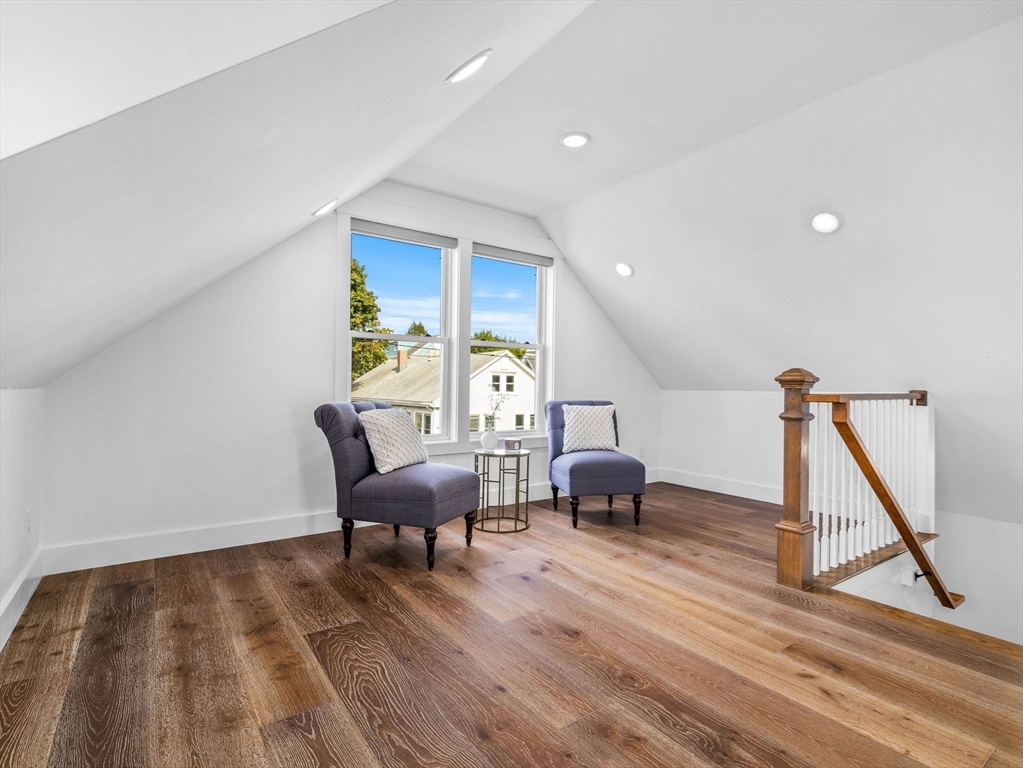 62 Governor Winthrop Road, Unit 2 Somerville, MA 02145 - Photo 9 of 32 a living room with furniture and a wooden floor
