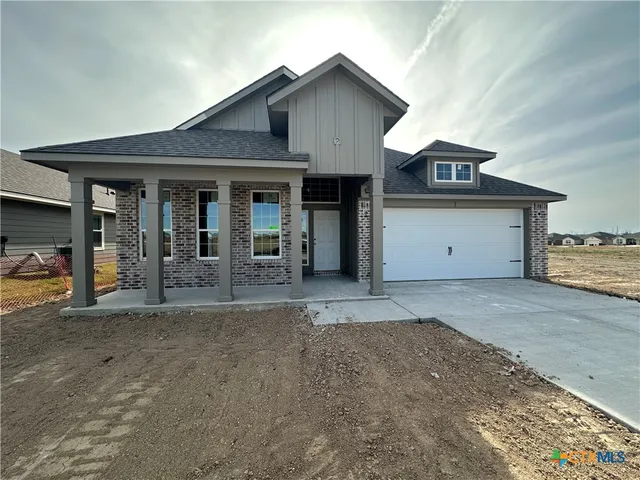 a front view of a house with a garage