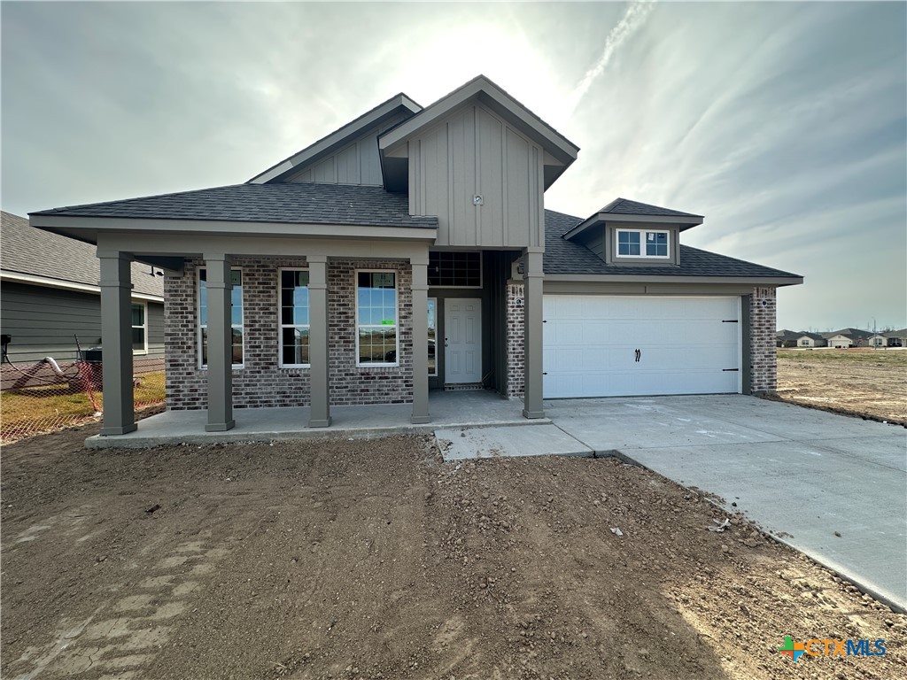 a front view of a house with a garage