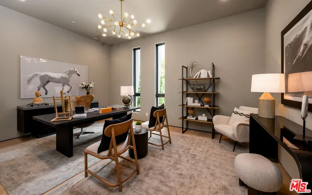 a view of a workspace with furniture and a potted plant