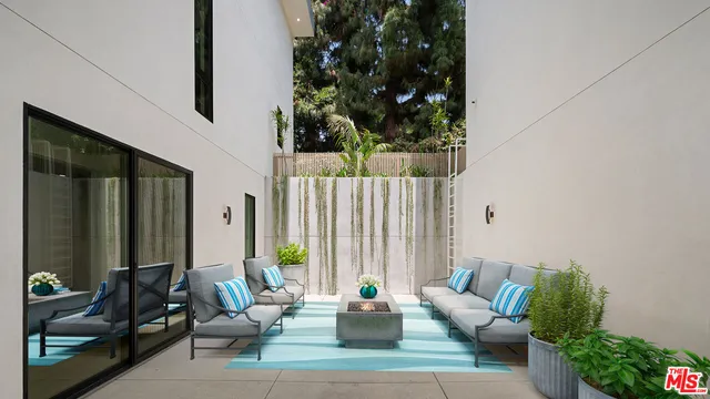 a outdoor living space with furniture and a potted plant