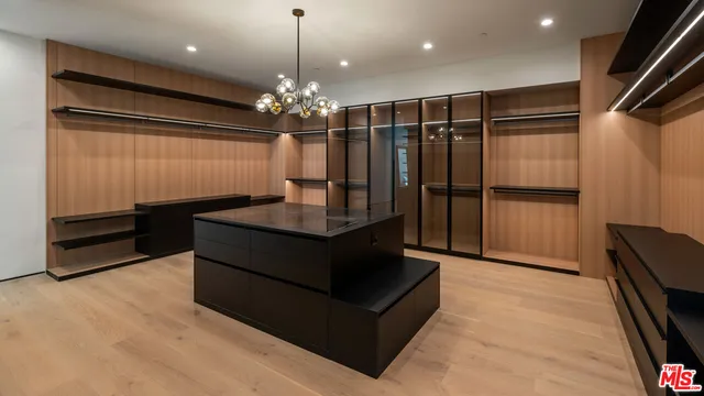 a lobby with furniture and a chandelier