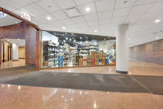 a living room with patio furniture and a large window