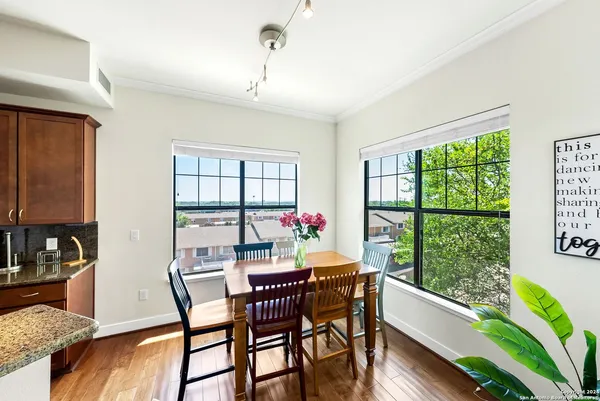 a view of a dining room with furniture window and outside view