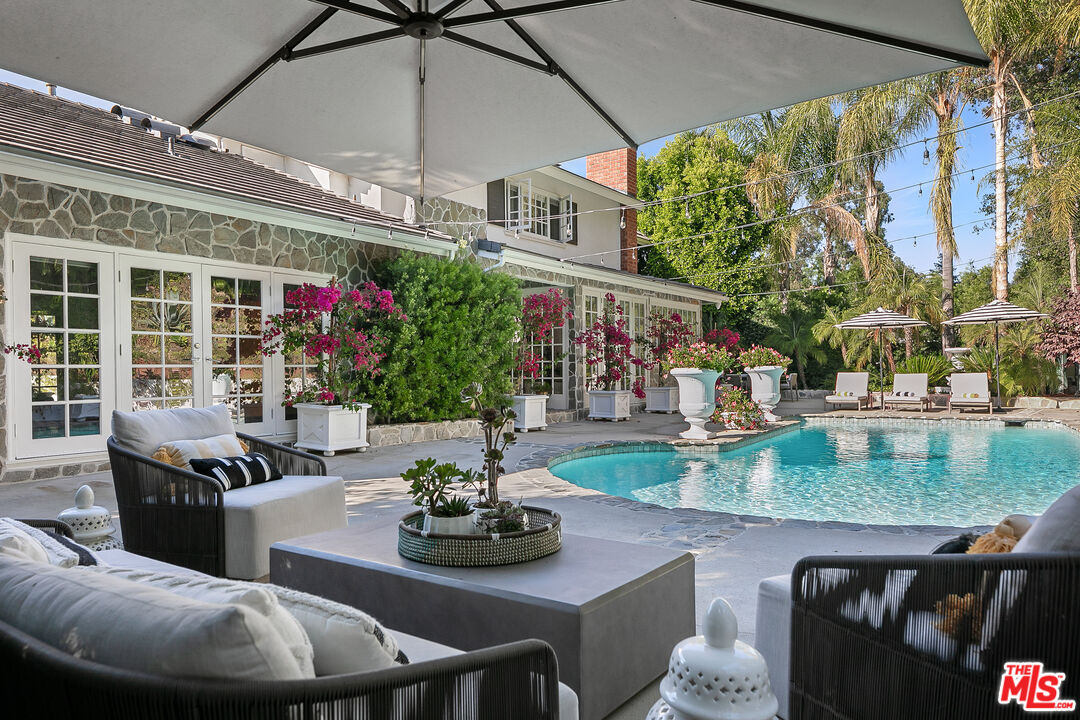 a dining room with furniture and a chandelier