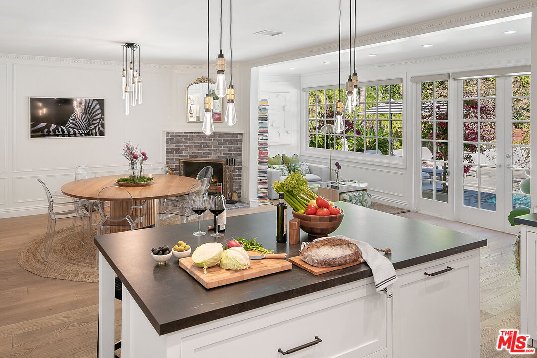 3228 Berry Drive Studio City, CA 91604 - Photo 12 of 40 a kitchen with a table and chairs