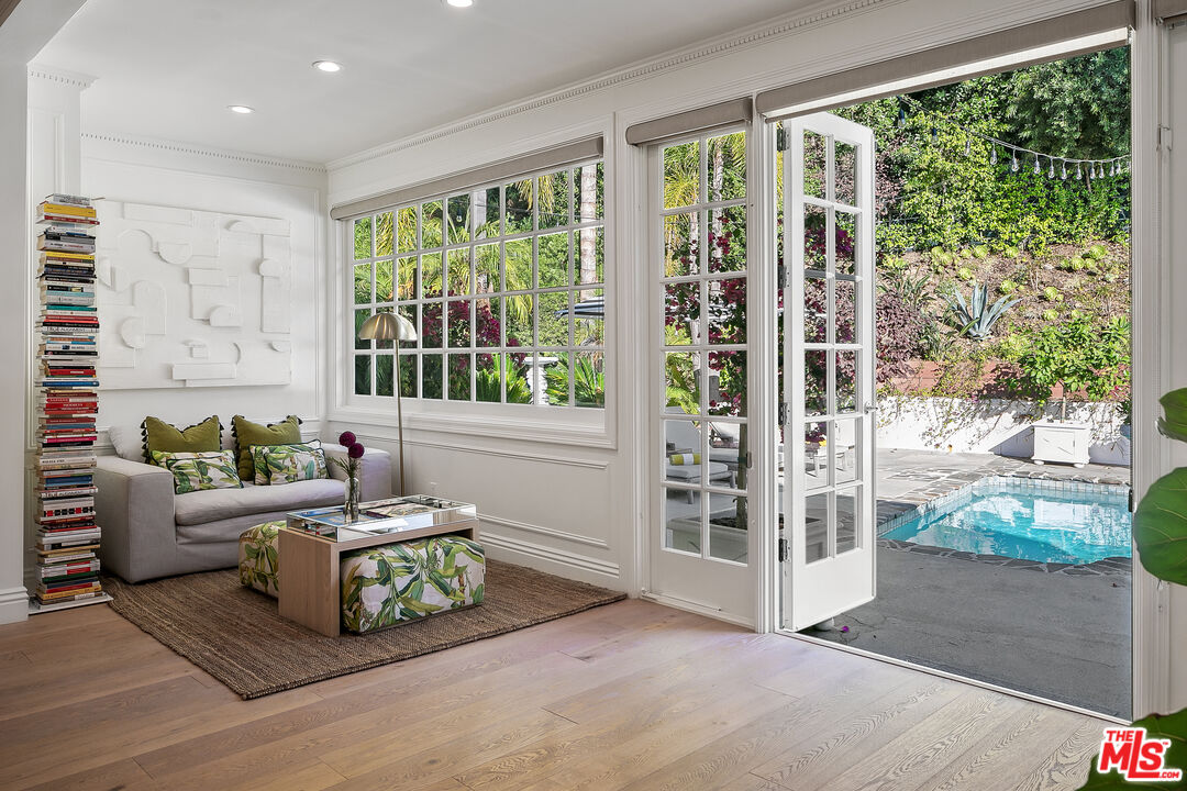 3228 Berry Drive Studio City, CA 91604 - Photo 14 of 40 a living room with furniture and a floor to ceiling window