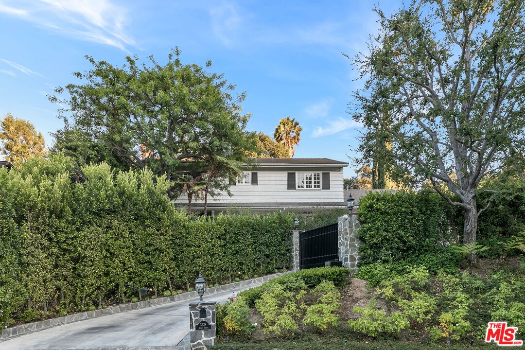 3228 Berry Drive Studio City, CA 91604 - Photo 2 of 40 a view of a house with a flower garden
