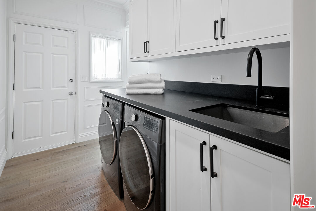 3228 Berry Drive Studio City, CA 91604 - Photo 21 of 40 a utility room with dryer and washer