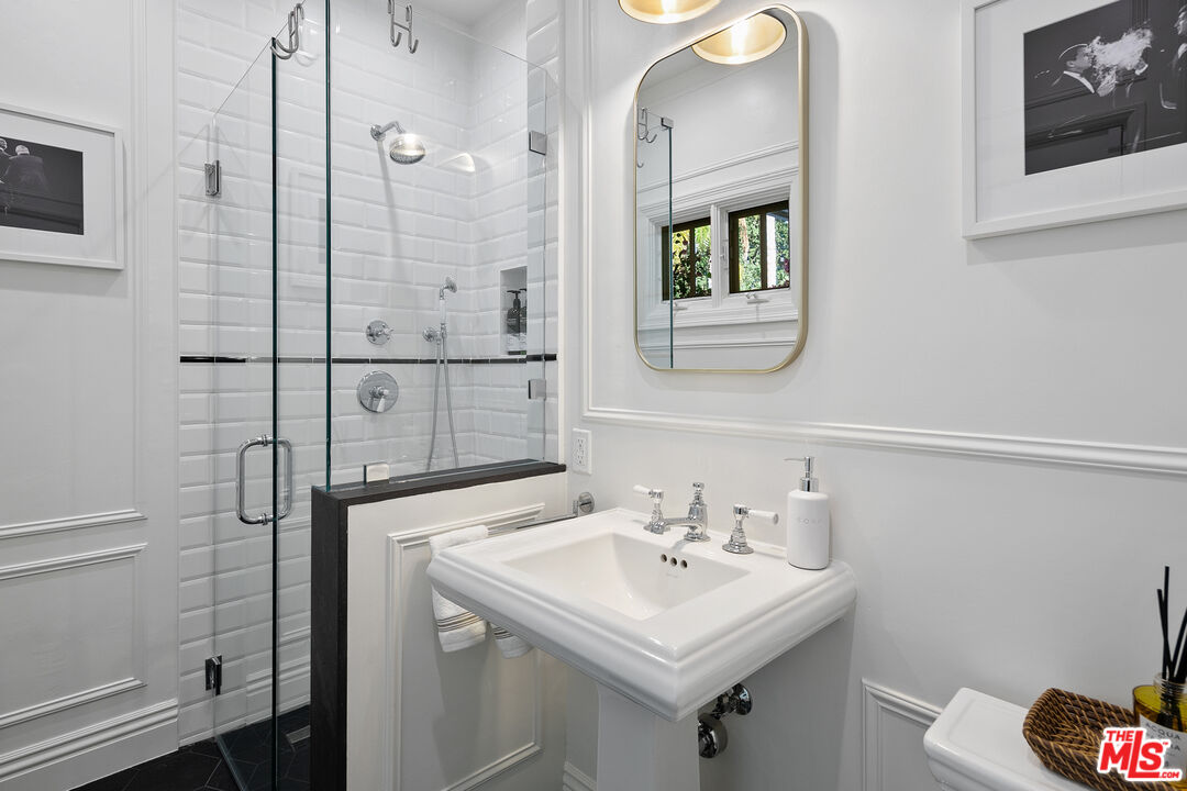 3228 Berry Drive Studio City, CA 91604 - Photo 22 of 40 a bathroom with a sink a toilet and shower