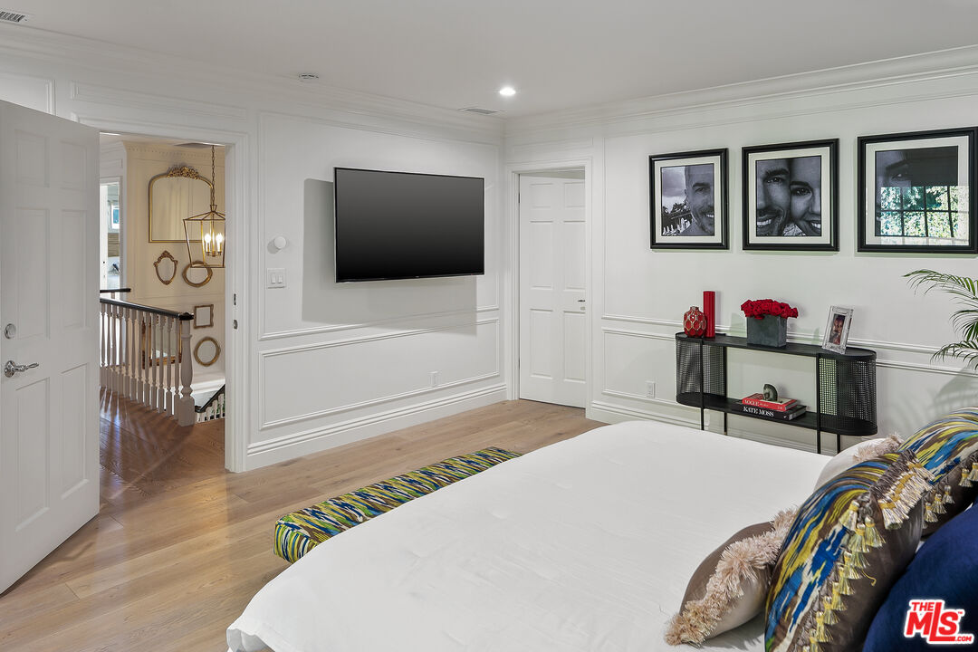 3228 Berry Drive Studio City, CA 91604 - Photo 25 of 40 a bedroom with a bed and a flat screen tv