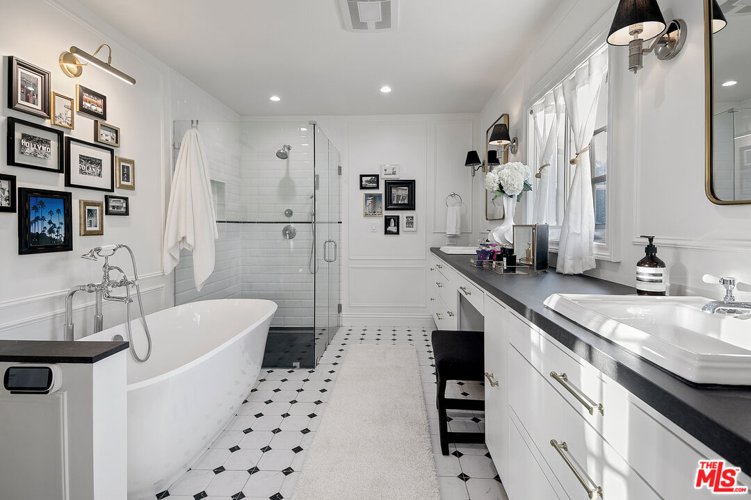 3228 Berry Drive Studio City, CA 91604 - Photo 26 of 40 a bathroom with a granite countertop sink a toilet a shower and a mirror