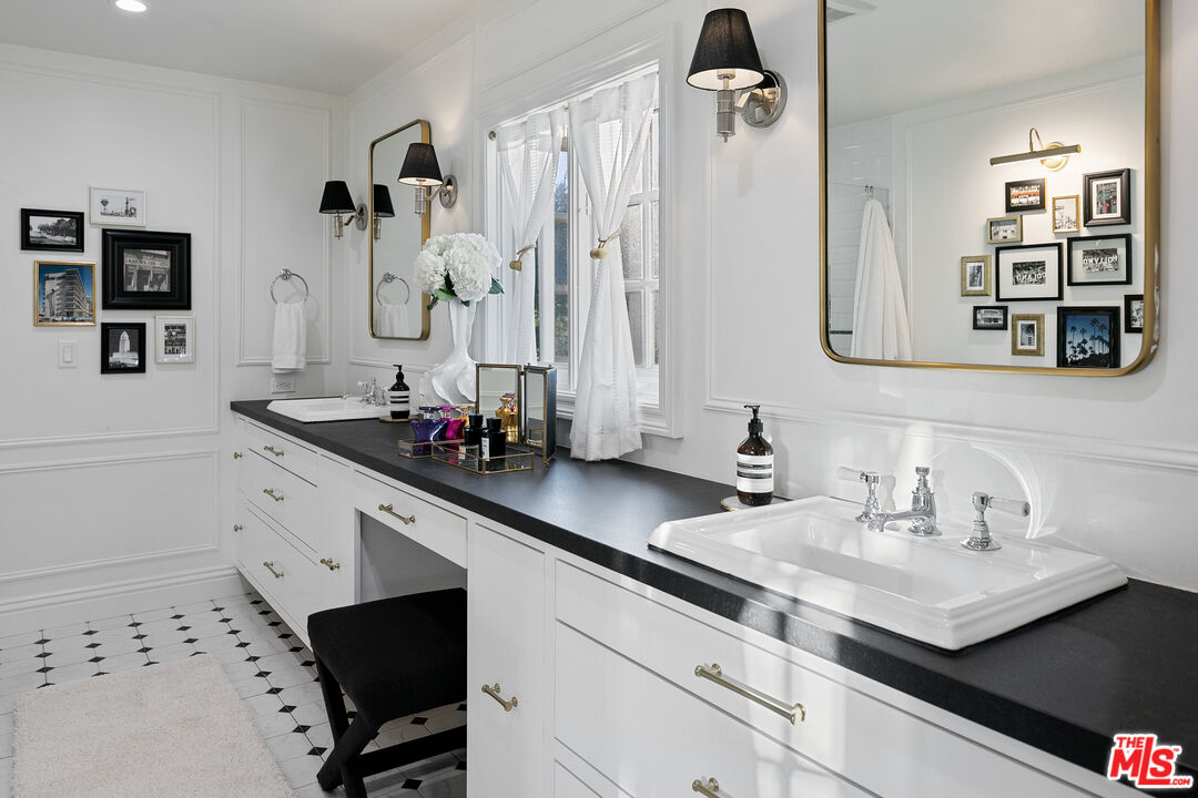 3228 Berry Drive Studio City, CA 91604 - Photo 28 of 40 a bathroom with sinks a mirror and shower