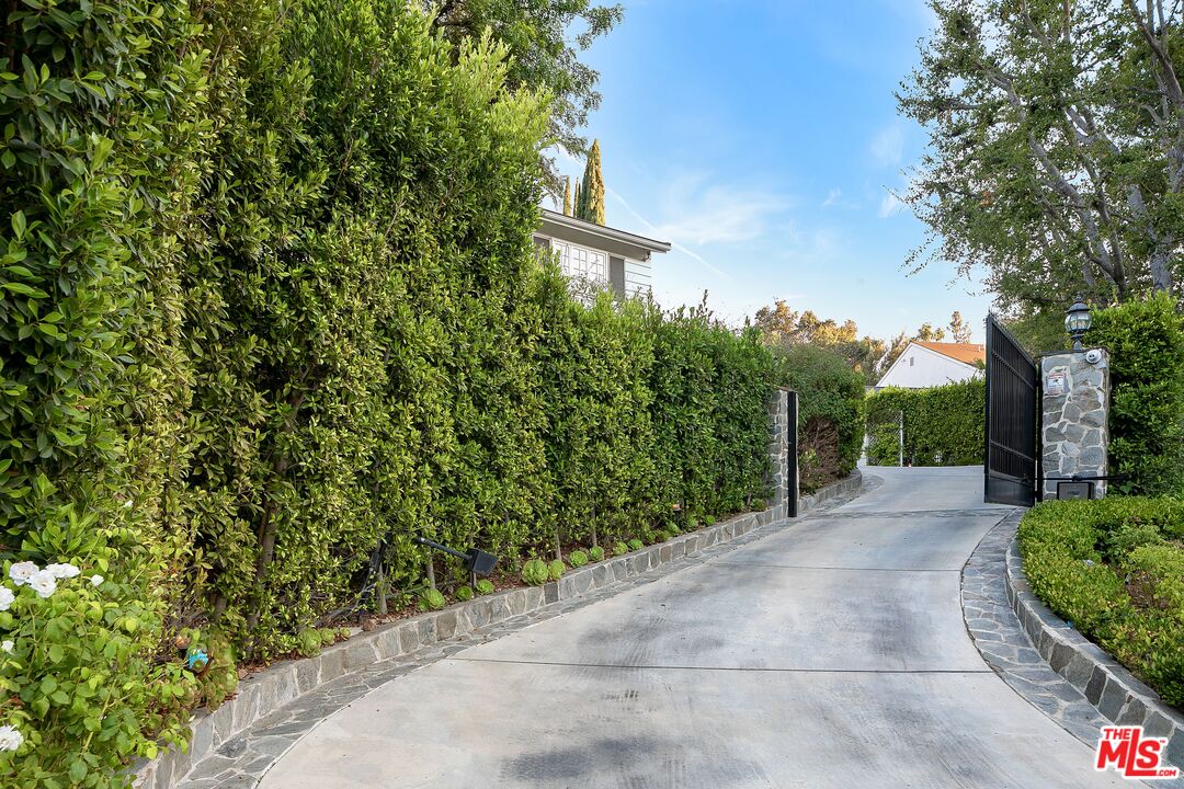3228 Berry Drive Studio City, CA 91604 - Photo 3 of 40 a view of a yard with plants and trees
