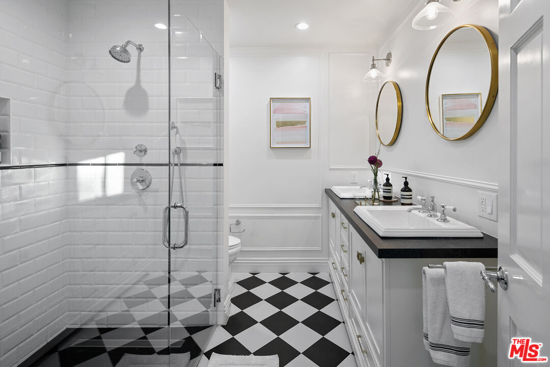 3228 Berry Drive Studio City, CA 91604 - Photo 31 of 40 a bathroom with a sink a toilet a mirror and shower