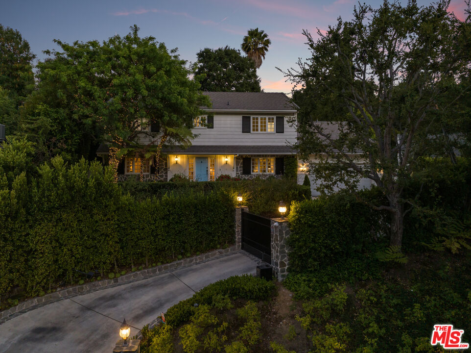 3228 Berry Drive Studio City, CA 91604 - Photo 35 of 40 a front view of a house with yard and green space
