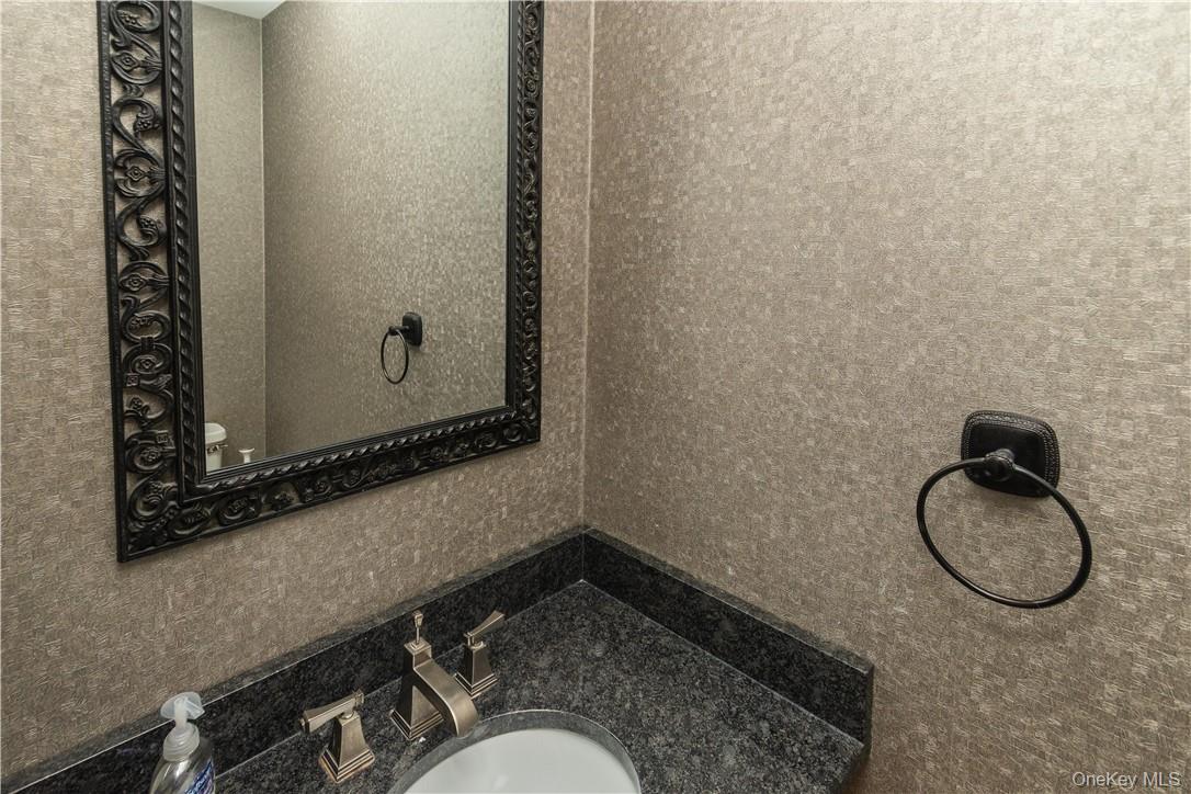 11 Peterson Road Monroe, NY 10950 - Photo 12 of 28 a bathroom with a granite countertop sink and mirror