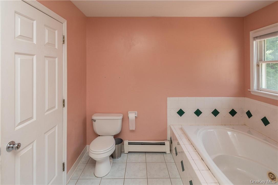 11 Peterson Road Monroe, NY 10950 - Photo 22 of 28 a bathroom with a toilet and a bathtub