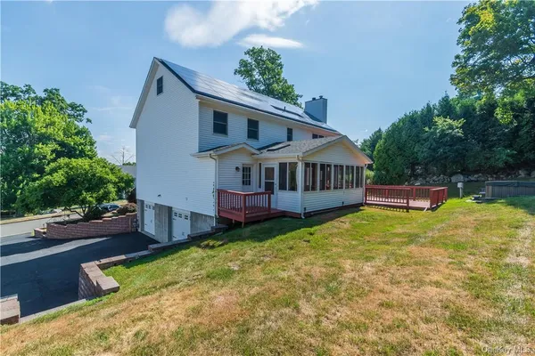 a aerial view of a house with swimming pool and porch