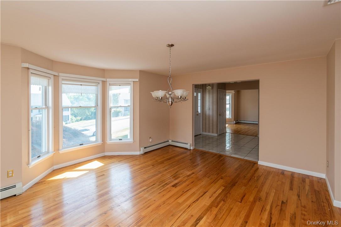 11 Peterson Road Monroe, NY 10950 - Photo 7 of 28 wooden floor in an empty room with a window