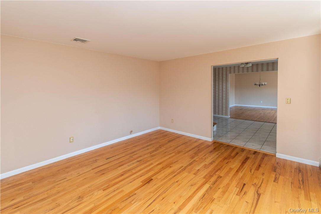 11 Peterson Road Monroe, NY 10950 - Photo 9 of 28 a view of empty room with wooden floor and fan