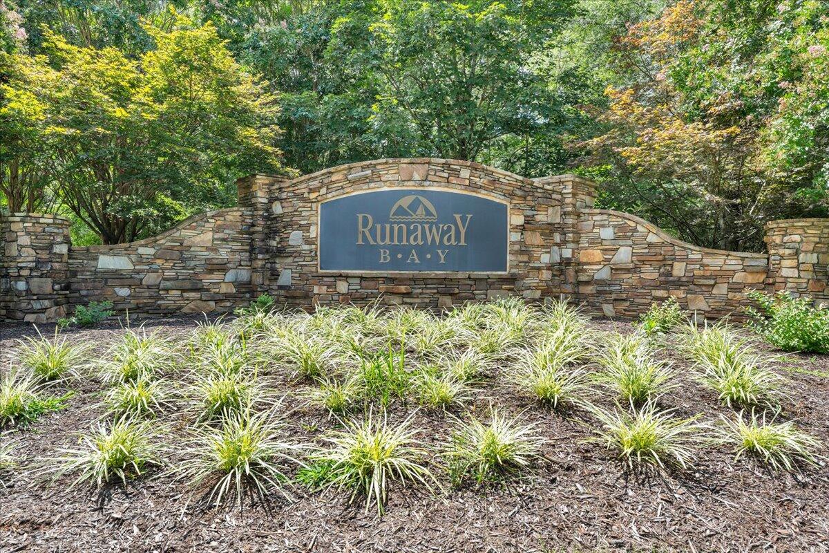 932 Clear Pointe Run Lynch Station, VA 24571 - Photo 148 of 154 a sign of golf club on a stone wall under a tree