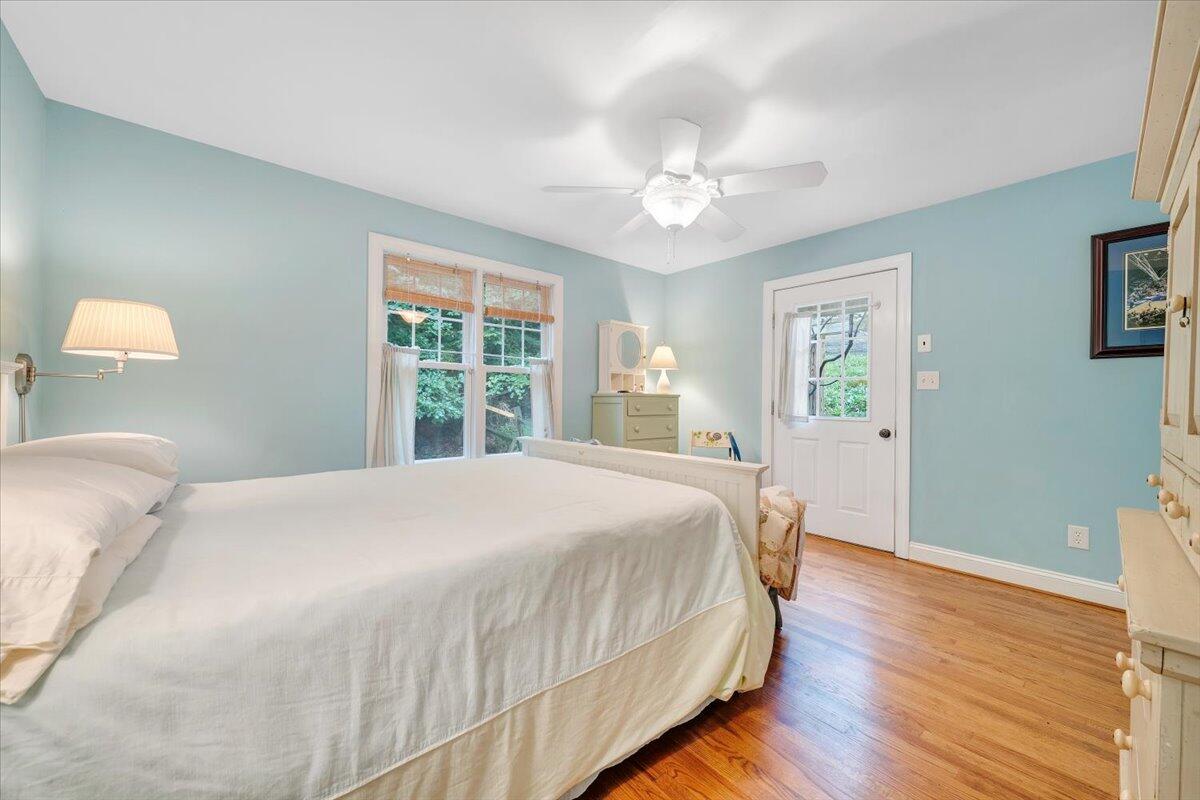 932 Clear Pointe Run Lynch Station, VA 24571 - Photo 30 of 154 a bedroom with a large bed and a chandelier