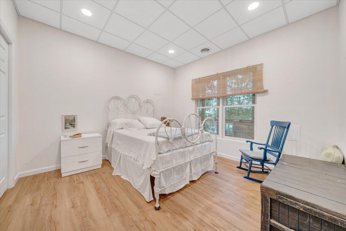 932 Clear Pointe Run Lynch Station, VA 24571 - Photo 45 of 154 a bed room with a bed and wooden floor