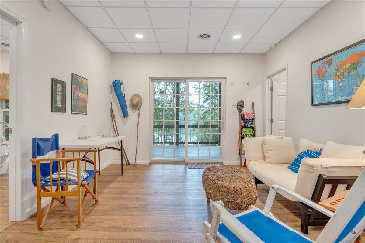 932 Clear Pointe Run Lynch Station, VA 24571 - Photo 50 of 154 a living room with furniture a flat screen tv and a floor to ceiling window