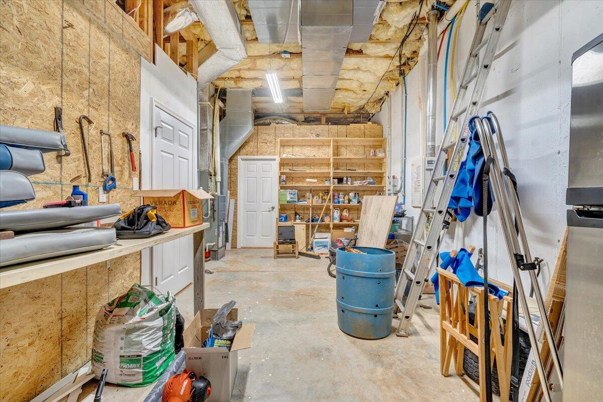 932 Clear Pointe Run Lynch Station, VA 24571 - Photo 56 of 154 a view of walk in closet with clothes and shoes